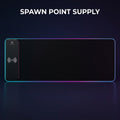 Extended black RGB gaming mouse pad with rainbow edge lighting wireless charging symbol and touch control on dark gaming desk