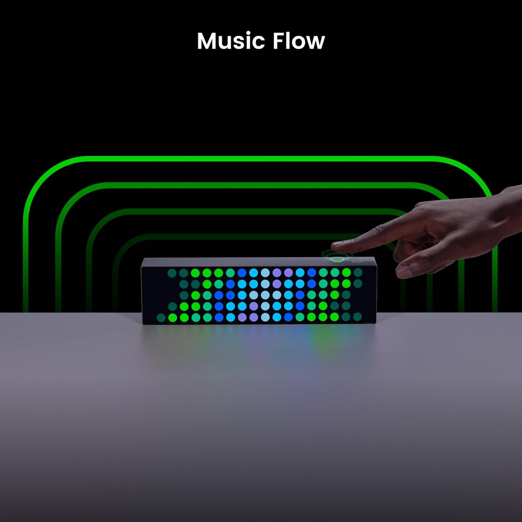 Colorful LED device with 'Music Flow' text and a hand interacting with it on a dark background.